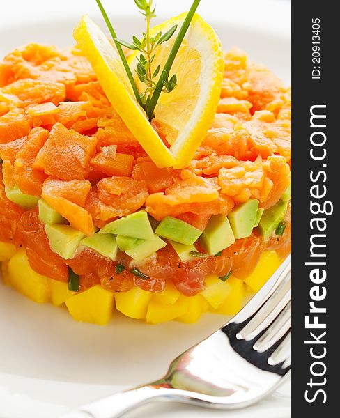 Fresh salmon tartar with avocado and pineapple. Fresh salmon tartar with avocado and pineapple.