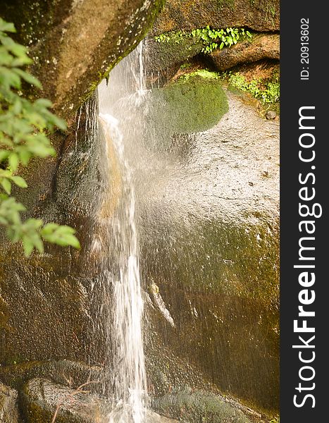 A Waterfall Breaking Through Stones