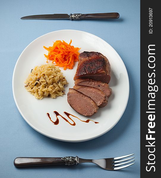 Sliced duck meat with rice and carrot vegetable. Sliced duck meat with rice and carrot vegetable.