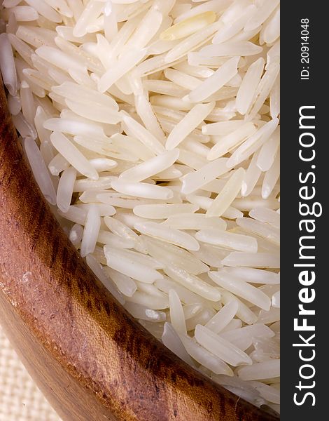 Close-up of white rice in a brown plate.