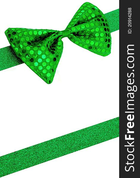 Background image with green bowtie and sparkly ribbon. Ribbon is cut and shaped from sparkly construction paper. Background image with green bowtie and sparkly ribbon. Ribbon is cut and shaped from sparkly construction paper.