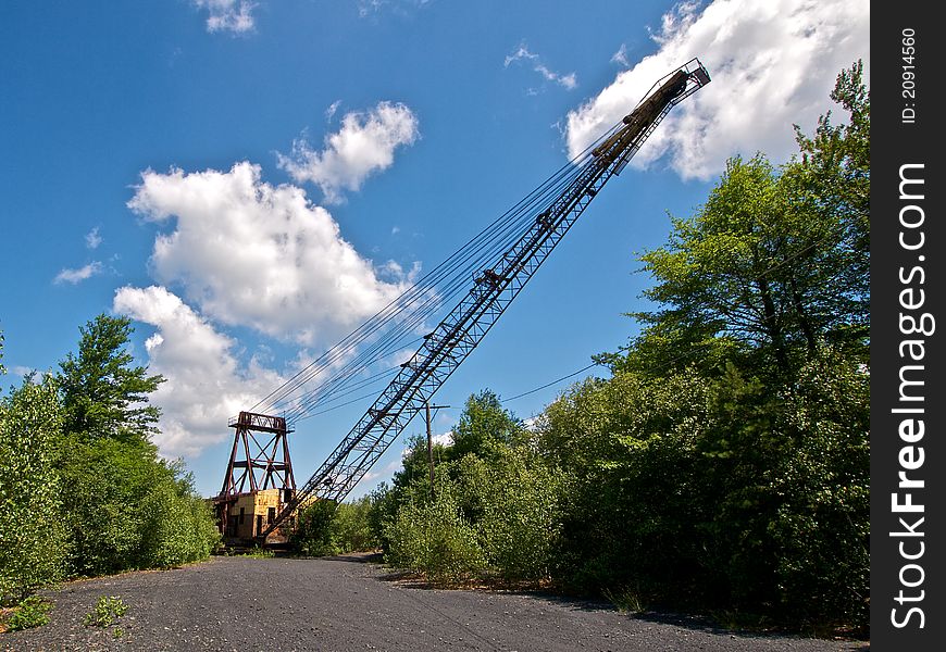 Frontal view of an abandoned derelict mining crane used for surface coal strip mining. Frontal view of an abandoned derelict mining crane used for surface coal strip mining.
