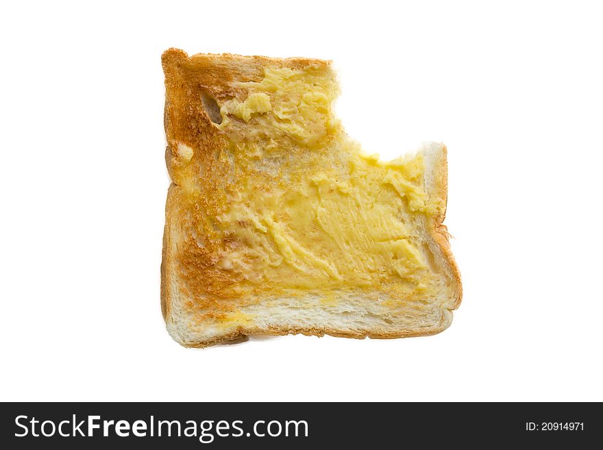 Butter the bread eaten on white background