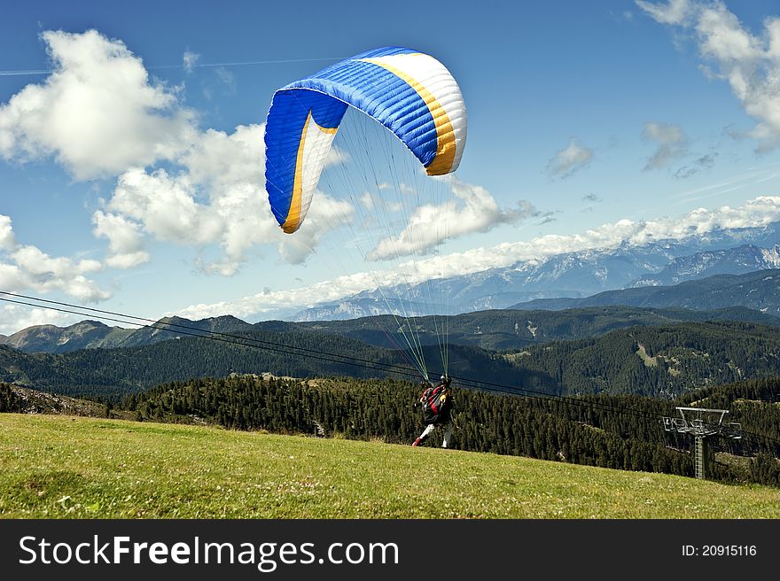 Paraglider Flying Over The Italian Alps