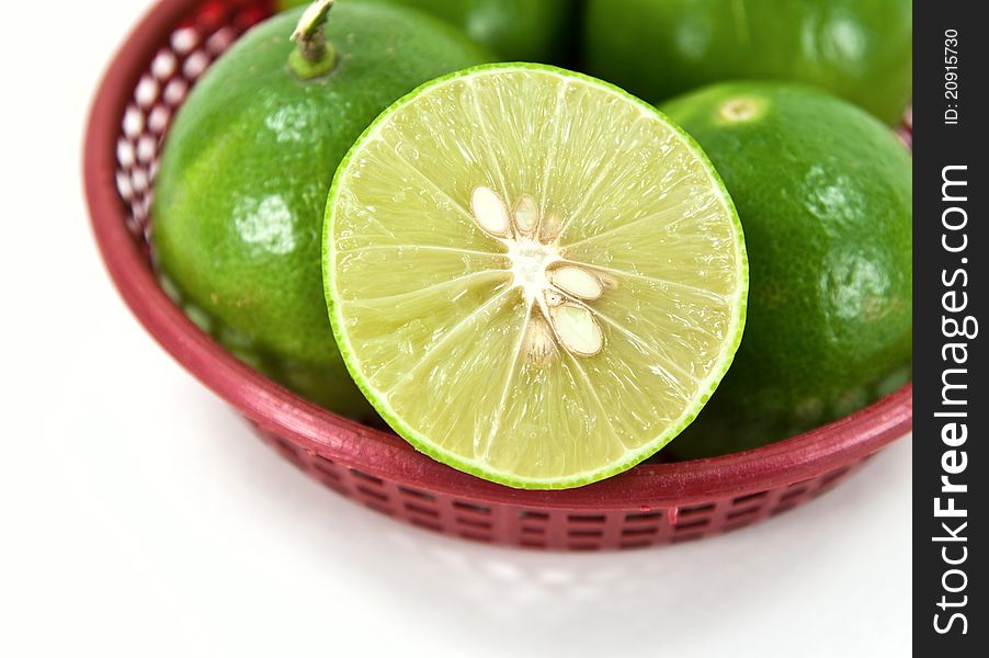 Group of lime and half lime in basket. Group of lime and half lime in basket.