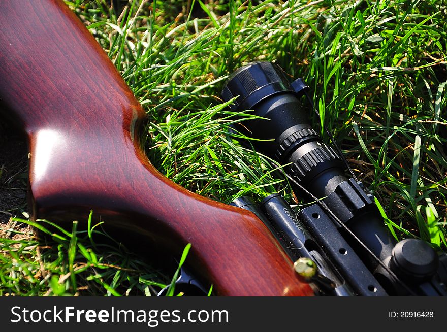 Air rifle lying on the grass