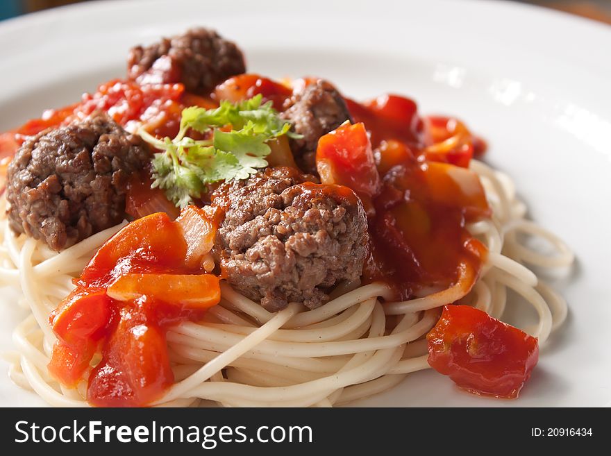 Meet ball spaghetti in white plate, shallow depth of field. Meet ball spaghetti in white plate, shallow depth of field