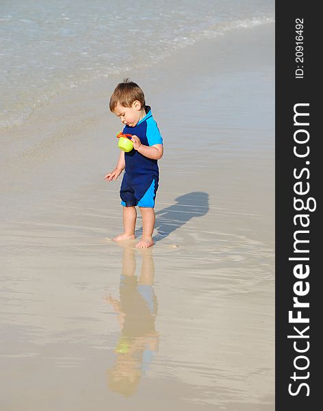 Toddler In Water By The Beach