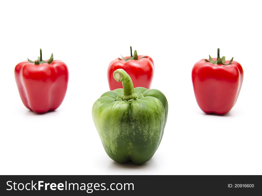 Green and red pepper on white background