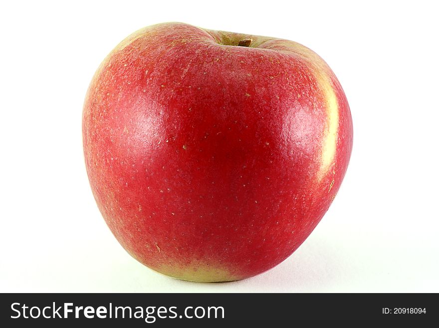 Single organic apple isolated on a white background. Single organic apple isolated on a white background