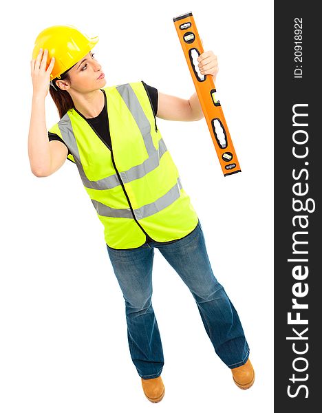 A females dressed in a high visibility jacket holding a spirit level on isloated white background. A females dressed in a high visibility jacket holding a spirit level on isloated white background