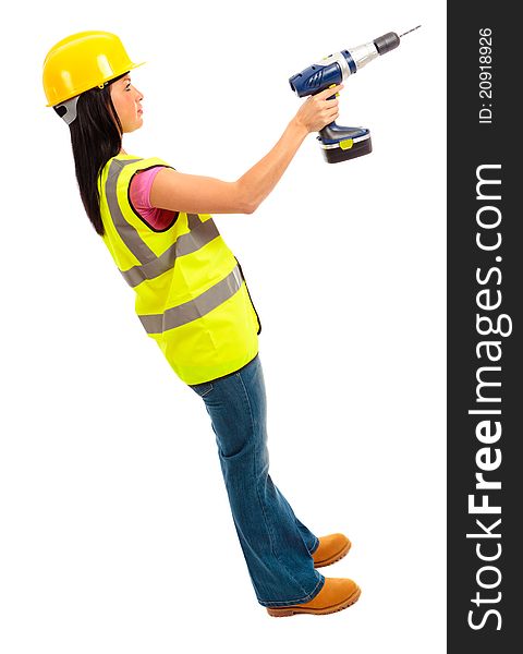 A females dressed in a high visibility jacket holding a cordless drill on isloated white background. A females dressed in a high visibility jacket holding a cordless drill on isloated white background