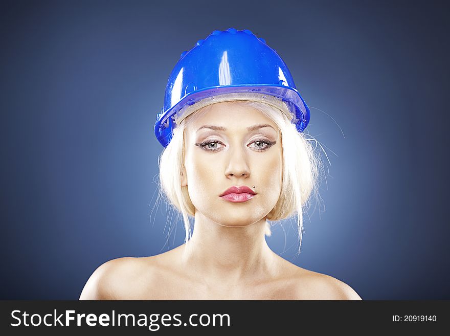 Beautiful blonde with construction helmet