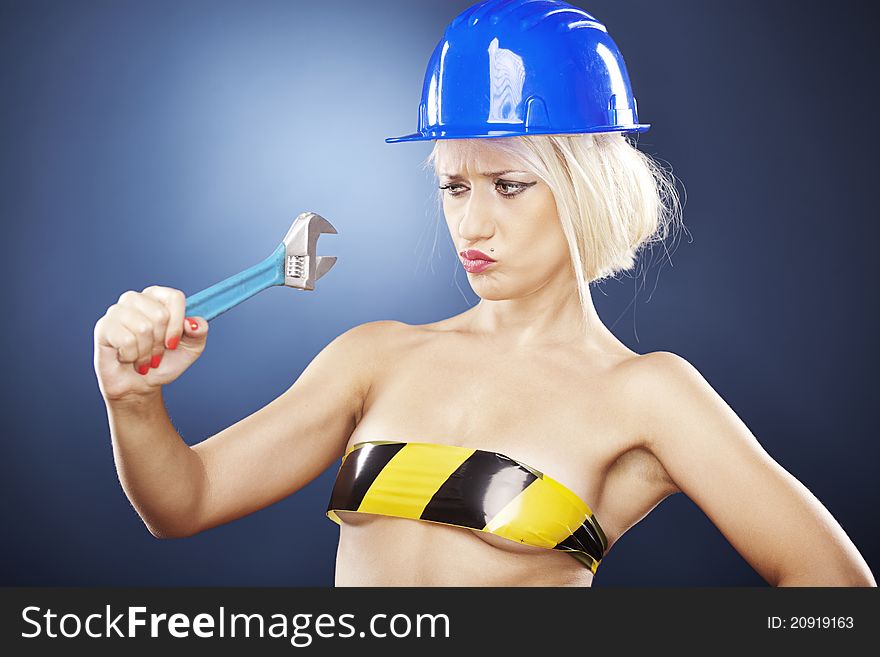 Attractive girl with construction helmet