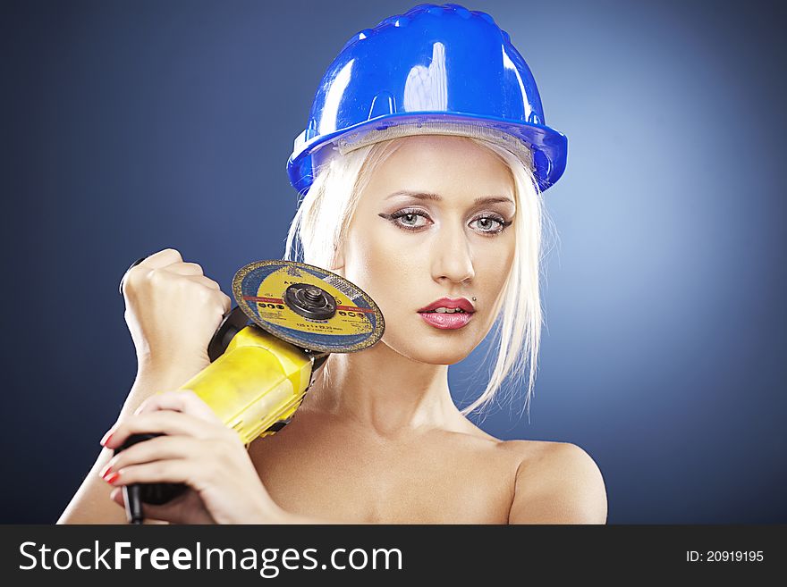 Portrait Of A Blonde Model With Angle Grinder