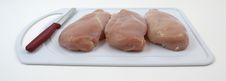 Free Chicken Breasts On Cutting Board With Knife Royalty Free Stock Photo - 20925075