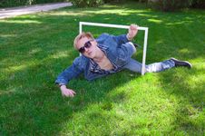 Young Human On The Green Grass With White Frame Royalty Free Stock Photography Young Human On The Green Grass With White Frame Royalty Free Stock Photography