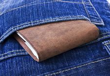 Leather Wallet With Money In Blue Jeans. Stock Images