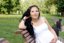 Beautiful Pregnant Girl Sitting On Bench Stock Images