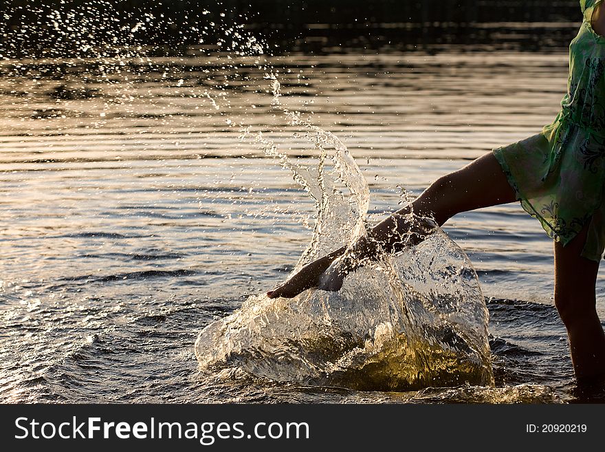 Woman splashing the water