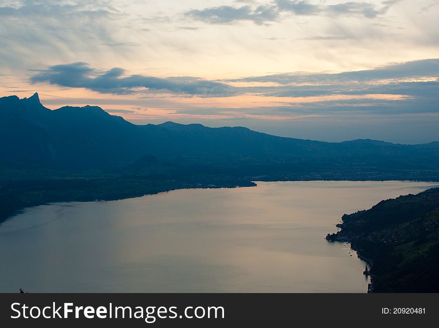 Mountains near lake with clouds