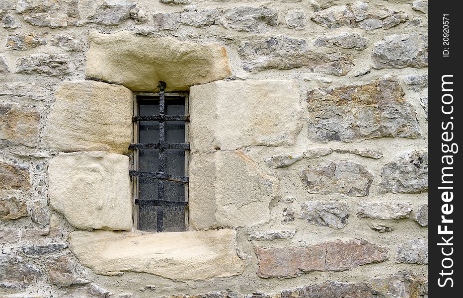 Old castle window with iron bars