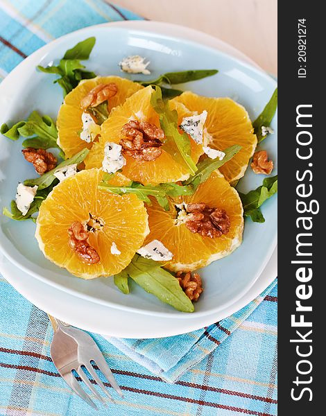 Fresh salad with oranges, walnuts and cheese