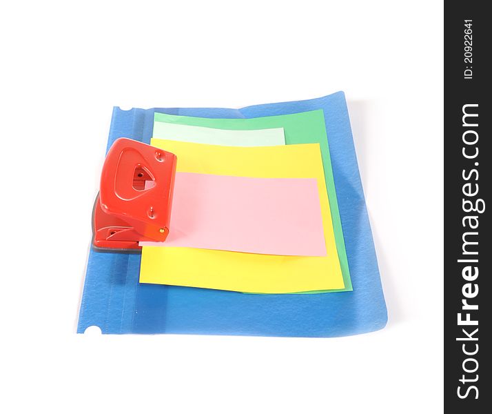 The color paper is pierced by a puncher and inserted into a folder. The color paper is pierced by a puncher and inserted into a folder