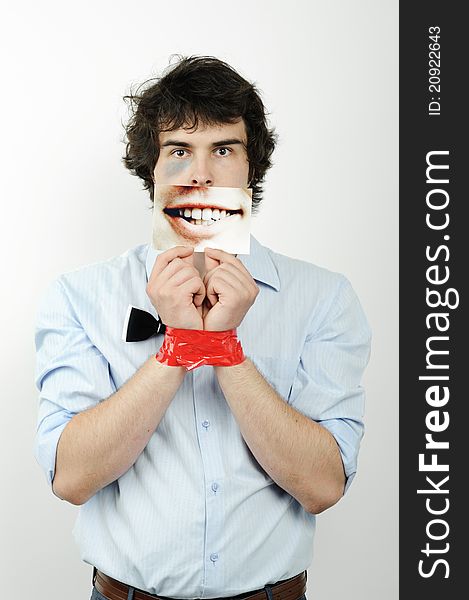 An image of a man with tape on his hands and a photo of a smile