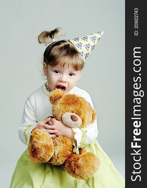An image of a portrait of a little girl with teddy-bear. An image of a portrait of a little girl with teddy-bear