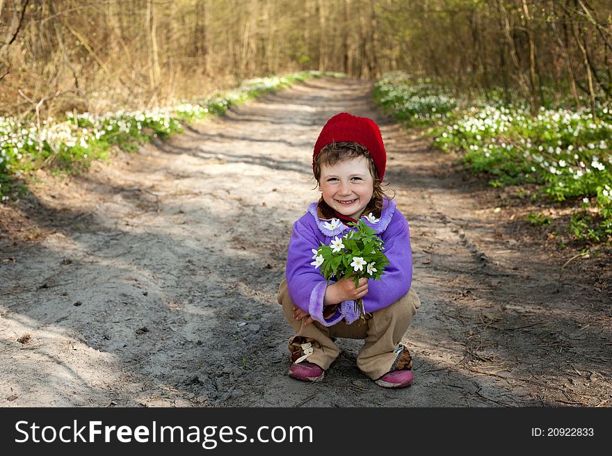 An image of a little girl in the forest
