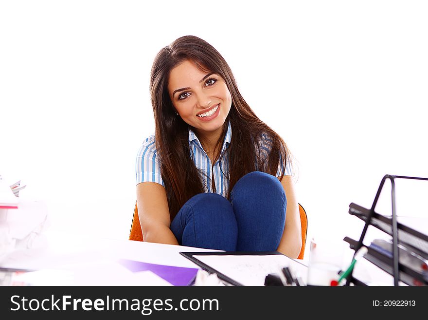 Young and beautiful student girl at the desk