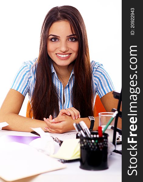Young and beautiful student girl at the desk