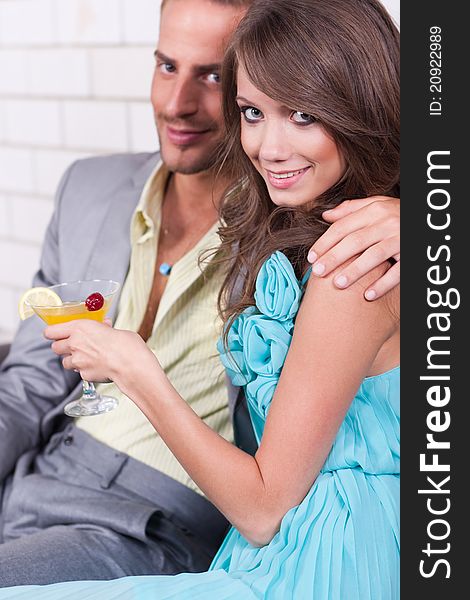 Amorous couple sharing fun moments together at restaurant. Amorous couple sharing fun moments together at restaurant.