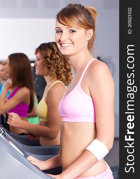 Group Of Women Running On Treadmill