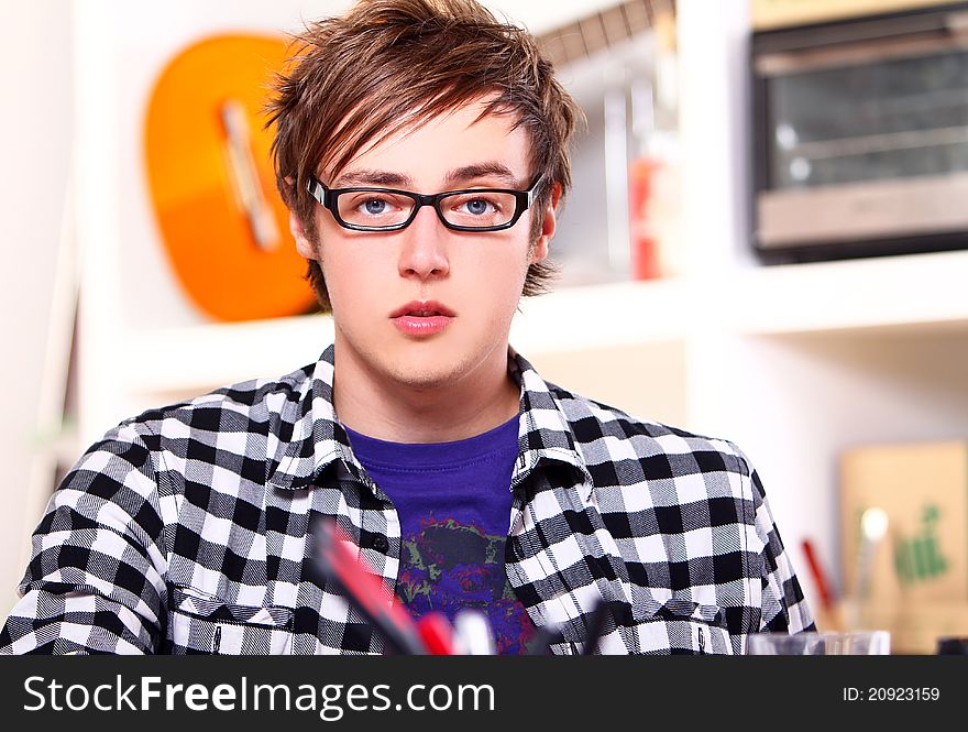 Young student in glasses at home. Young student in glasses at home