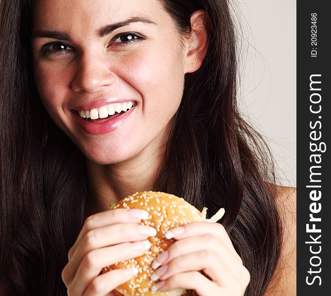 Woman eat burger isolated on white background