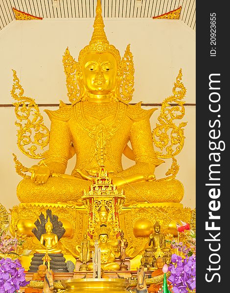 Sitting golden buddha image at a temple in Ratchaburi,Thailand
