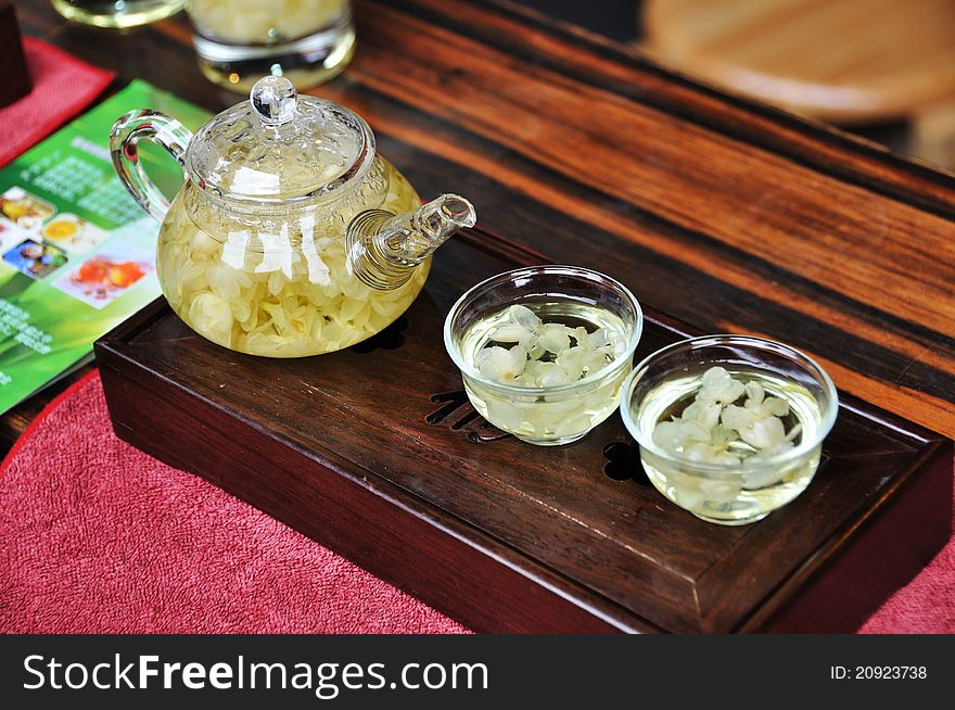 Glass teapot with jasmine tea
