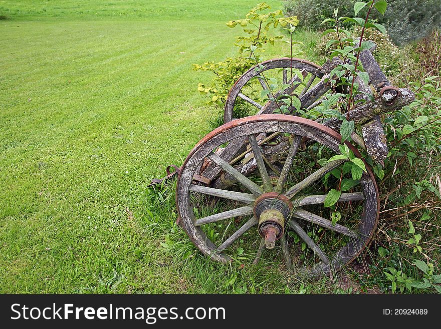 An ancient weathered farming trailer. An ancient weathered farming trailer