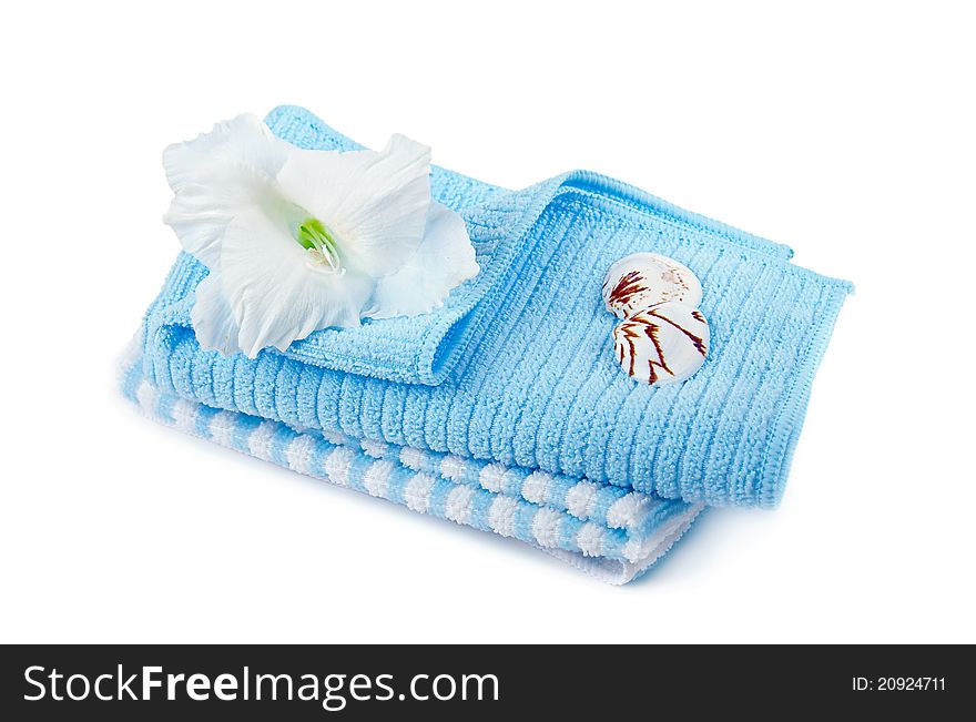 Two cotton towels and a tropical flower