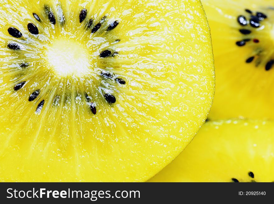 Yellow kiwi fruit in background