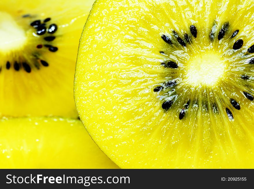 Yellow kiwi fruit in background