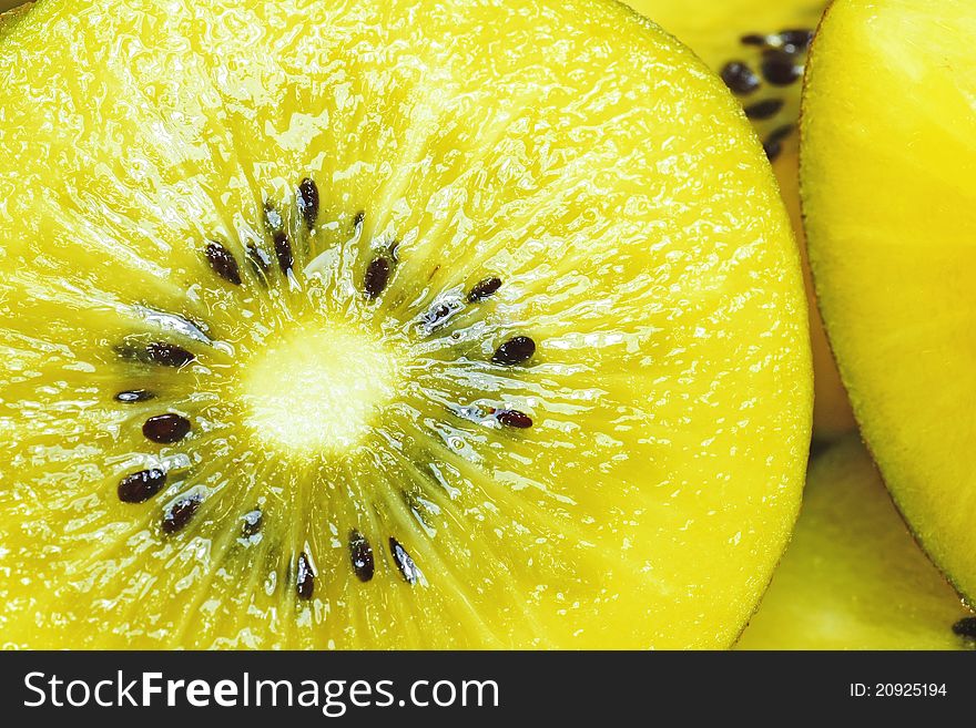 Yellow kiwi fruit in background