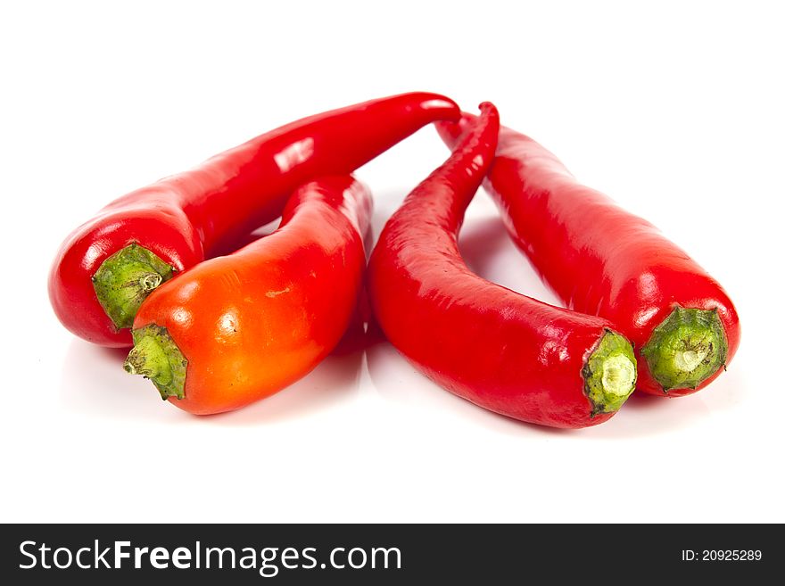 Fresh red hot pepper on a white background. Fresh red hot pepper on a white background