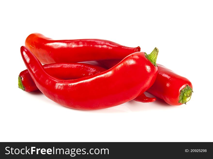 Fresh red hot pepper on a white background. Fresh red hot pepper on a white background