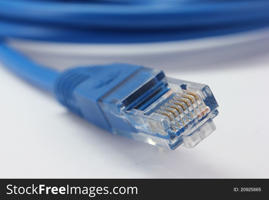 Blue computer cable from white background. Blue computer cable from white background