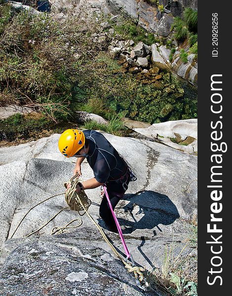 Men prepering to rappel on waterfall. Men prepering to rappel on waterfall