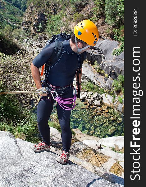 Men prepering to rappel on waterfall. Men prepering to rappel on waterfall