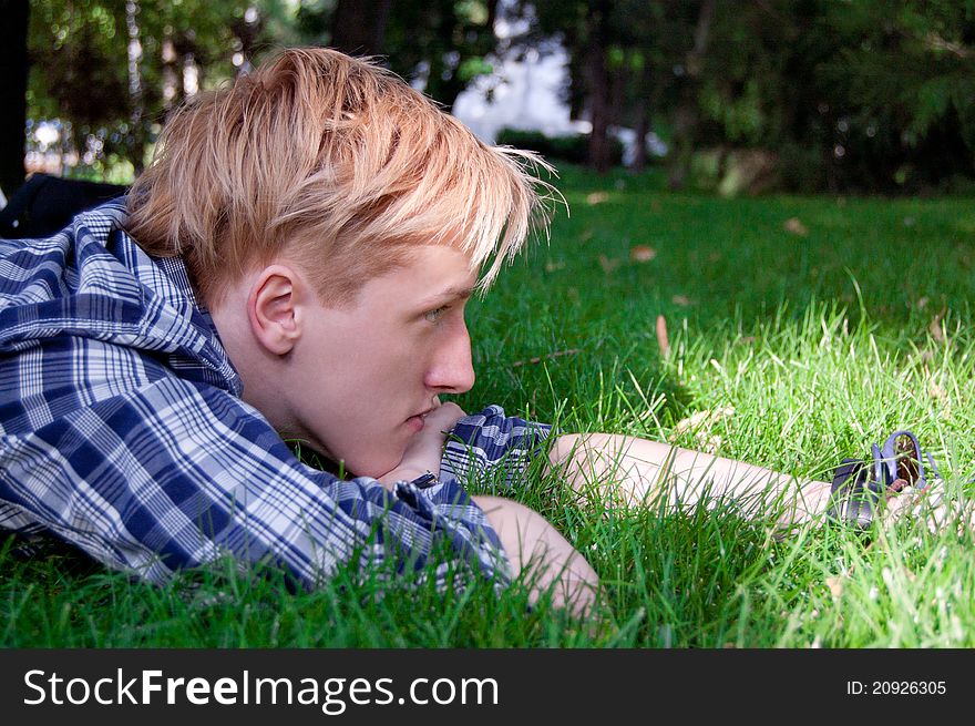 Young human on the green grass